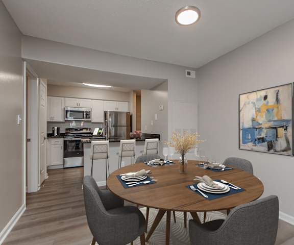 A dining room with a table set for six.