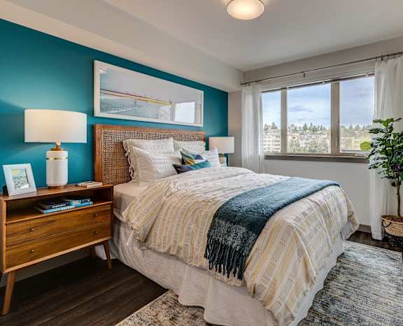 a bedroom with a bed and a window