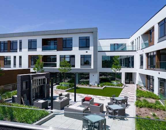 a rendering of a large building with a courtyard and tables and chairs at The Rail at Red Bank, Red Bank, 07701