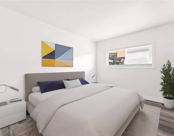 A bedroom with a large bed and a painting on the wall.