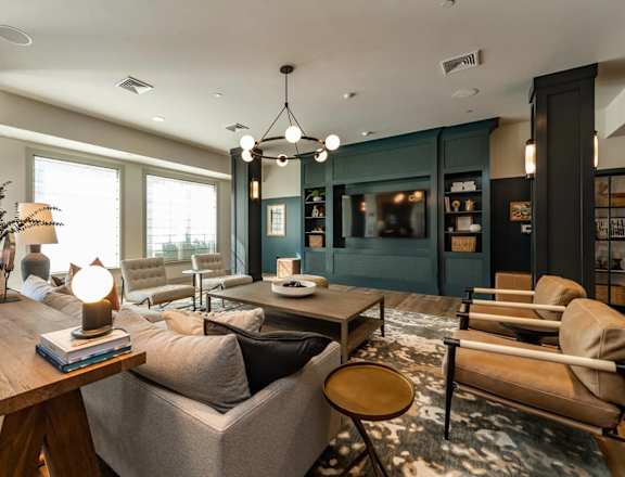A modern living room with a wooden coffee table and grey sofa.