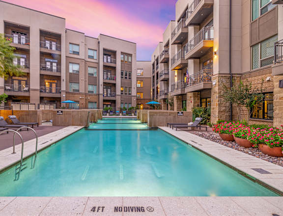 an apartment complex with a swimming pool