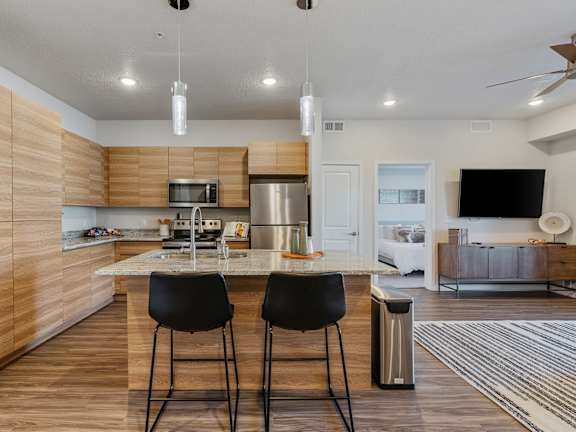Kitchen with Wooden Cabinets at The Flats at Riverwoods, Provo, Utah