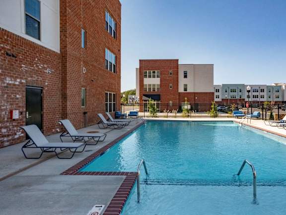 our apartments have a large swimming pool with lounge chairs