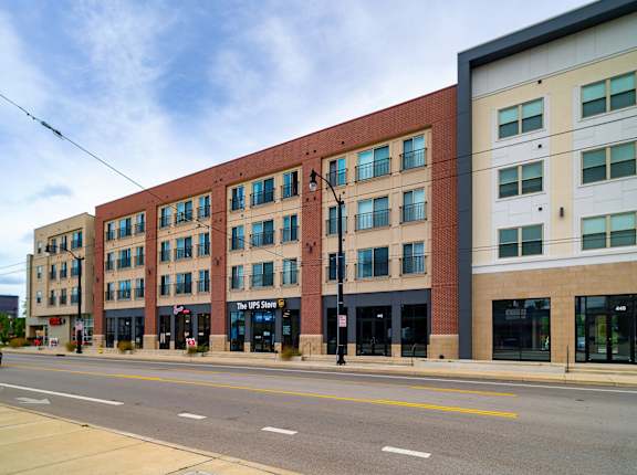 a large brick building on the corner of a street