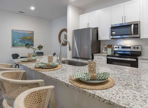 a kitchen with a granite counter top and a sink