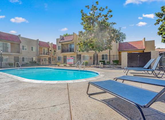 our apartments have a resort style pool and lounge chairs