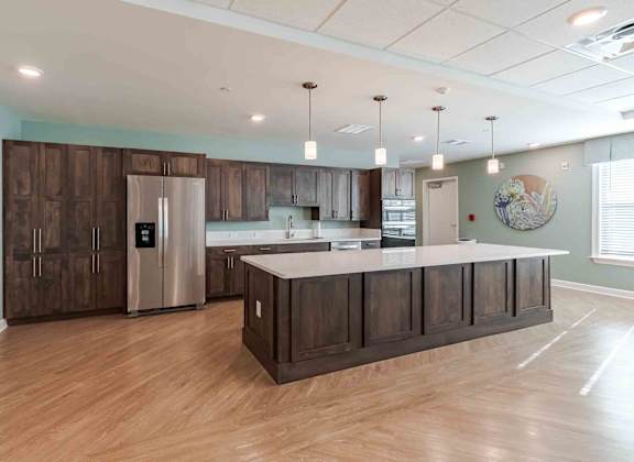 A kitchen with wooden cabinets and a white countertop.