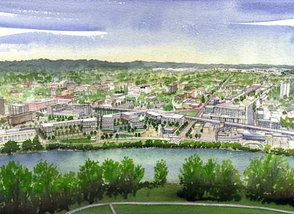 an aerial view of a city with a lake