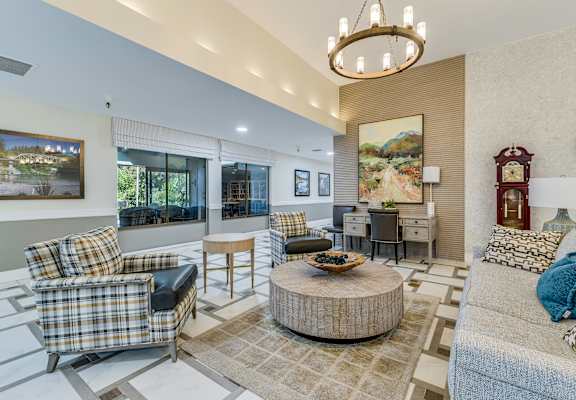 A living room with a couch, chair, and coffee table.