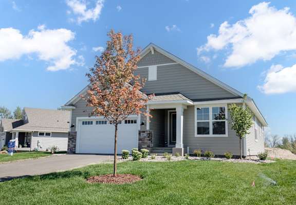 a house with a tree in the front yard