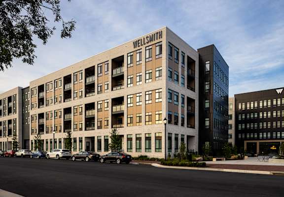 a rendering of the exterior of a building with a sign that reads walnut