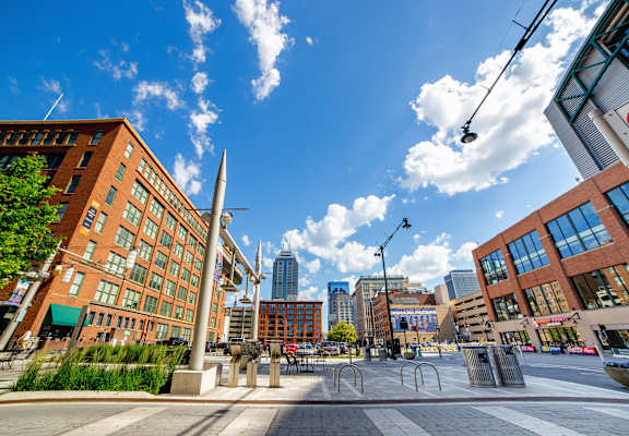 Street view of building exteriors near Harness Factory Lofts, Managed by Buckingham Urban Living, Indianapolis, IN