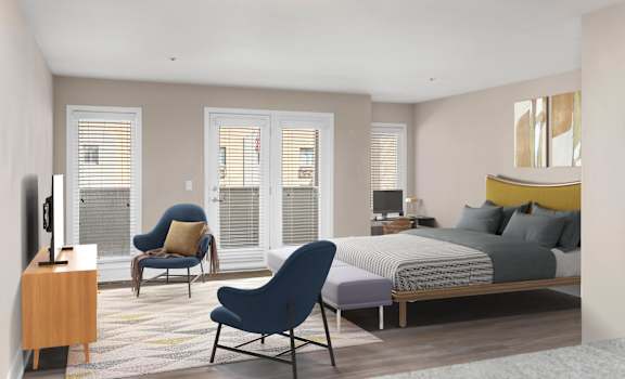 a bedroom with a bed and a chair in a room
