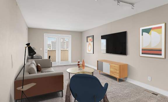a living room with beige walls and a flat screen tv on the wall