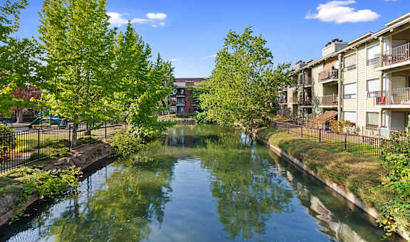 A canal with apartment buildings on either side.