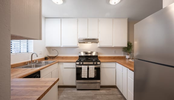 Kitchen interior view at Oak Park Apartments, California, 93463