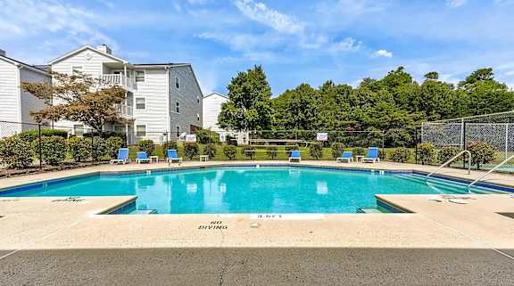 A swimming pool with the words at Sedgefield Square Apartments, North Carolina, 27407