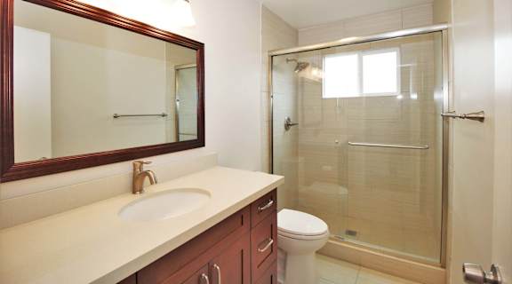 a bathroom with a sink toilet and a shower