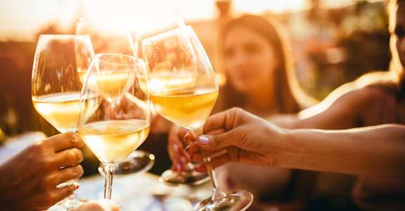 people toasting wine glasses at Eagle Glen Apartments