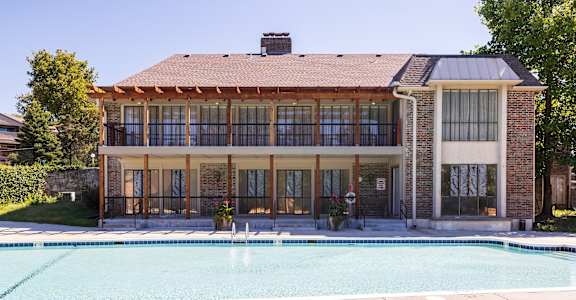 A spacious swimming pool area at Regent’s Walk Apartment Homes, ideal for unwinding.