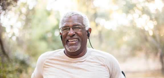 Active adult enjoying outdoor fitness near Sage 5430 55+ apartments in Norcross, GA