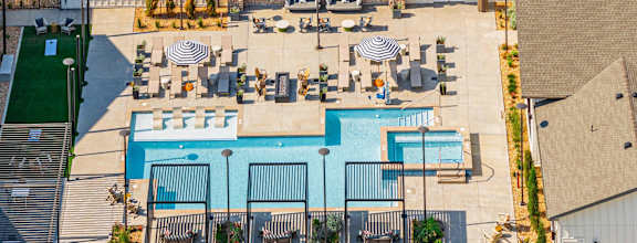 A large building with a pool in front.