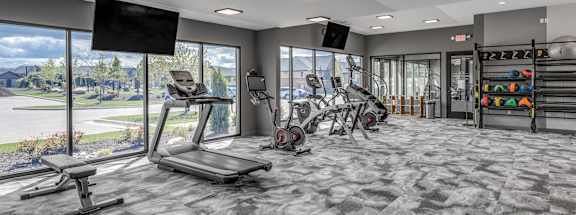 On-site fitness studio at Quarry Apartments and Townhomes in DeWitt, Michigan