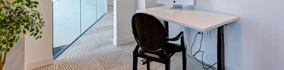 a home office with a computer on a desk