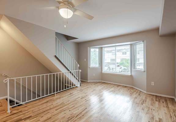 A room with a staircase and a ceiling fan at Seaview Apartments in Staten Island, NY, 10305