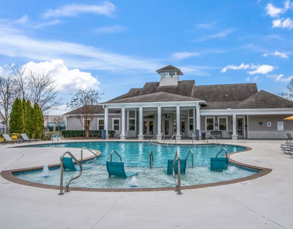 the swimming pool at the clubhouse at the estates apartments