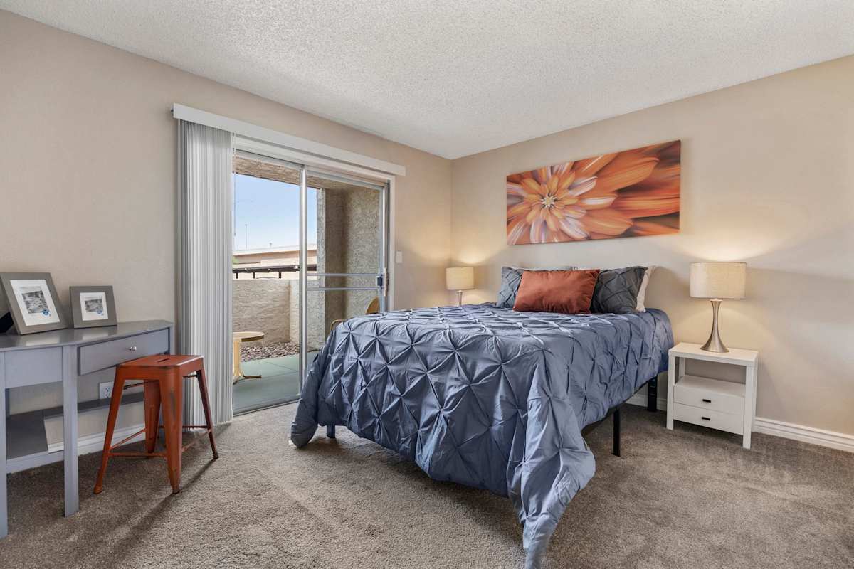 Furnished bedroom shown — representative home at The Place at Wickertree.