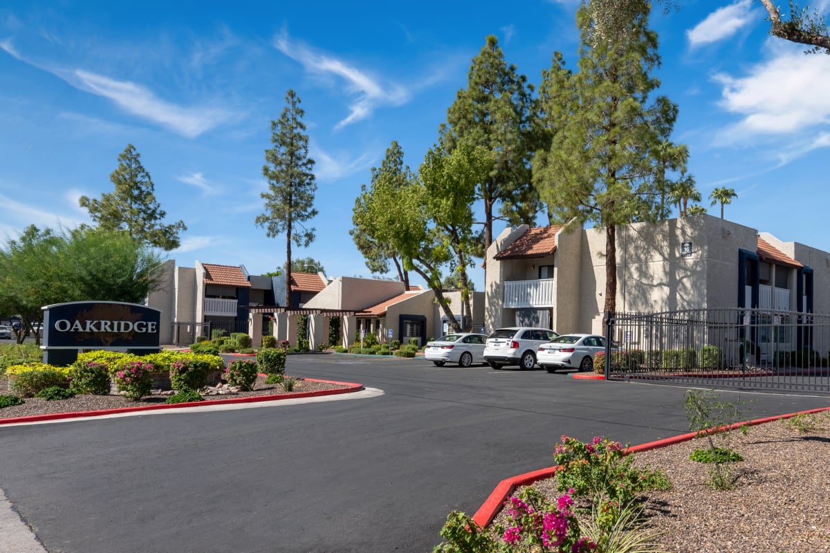 Oakridge entrance and landscaped grounds at Oakridge Apartments.