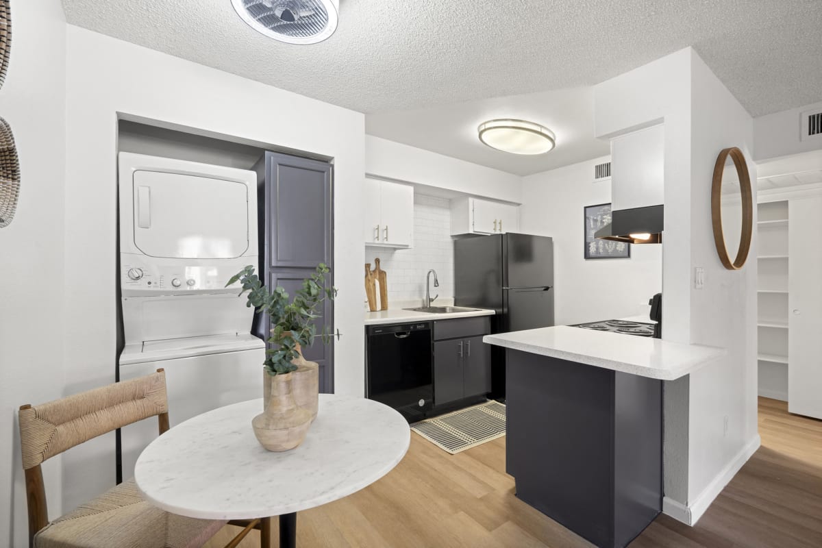 Dining area and kitchen at Oakridge Apartments.