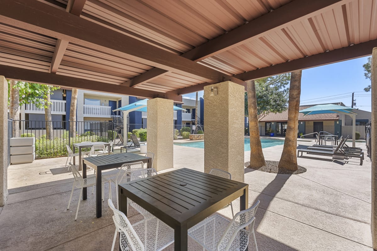 Covered outdoor tables at Oakridge Apartments.