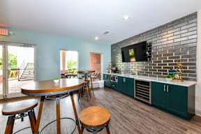 A kitchen with a bar area and a dining table. at Park at Forest Hill Apartments, Memphis, Tennessee