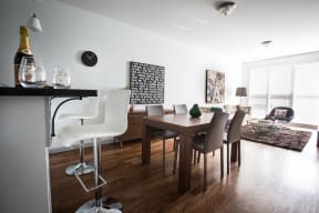 Open layout of breakfast bar, dining room and living room area