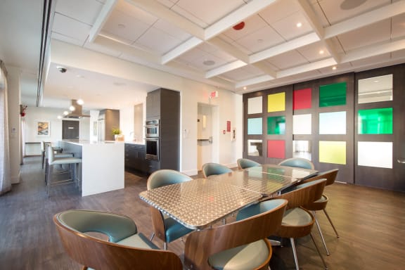 a dining room with a table and chairs at Versus, Calgary, Alberta