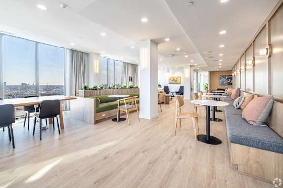 A modern living room with a view of the city.