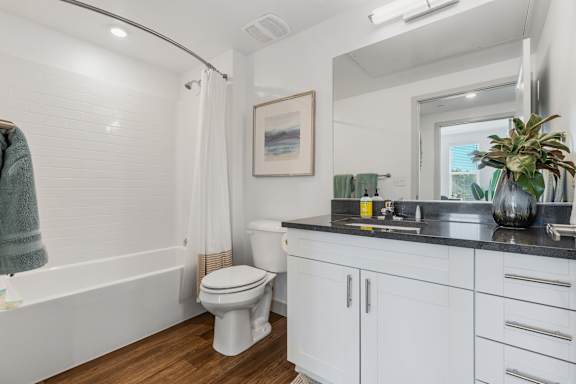 Bathroom with a toilet and a sink and a mirror at City View St. George, St. George, UT, 84770