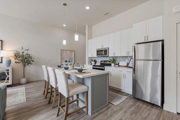 Modern kitchen with a dining table and chairs at 200 City View, Provo, UT, 84601