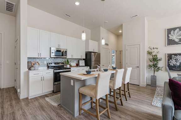 Modern kitchen with a dining table and chairs at 200 City View, Provo, UT