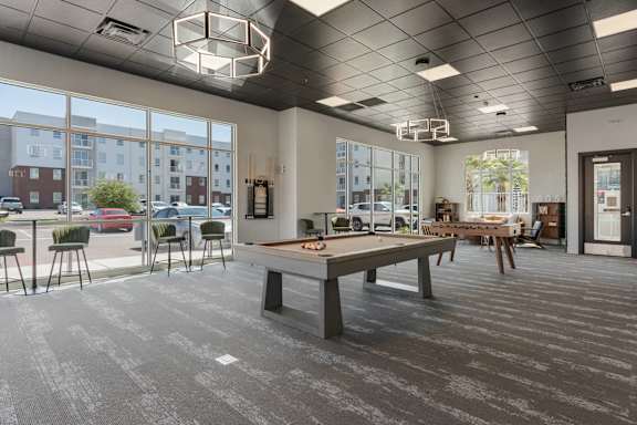 A large room with a long table and chairs. 605 Place Student Housing & Co-Living, St George Utah