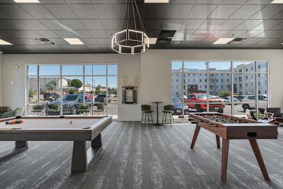 A room with a pool table and a foosball table. 605 Place Student Housing & Co-Living, St George, UT