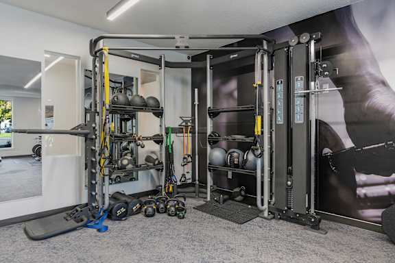 Home Gym with Weights at The Flats at Riverwoods, Provo
