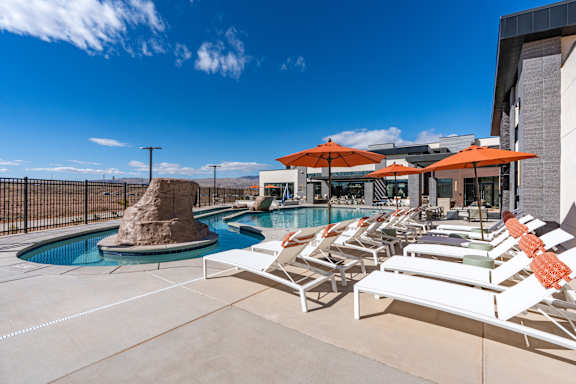 Chairs around the pool at The Vue At Desert Color, St. George