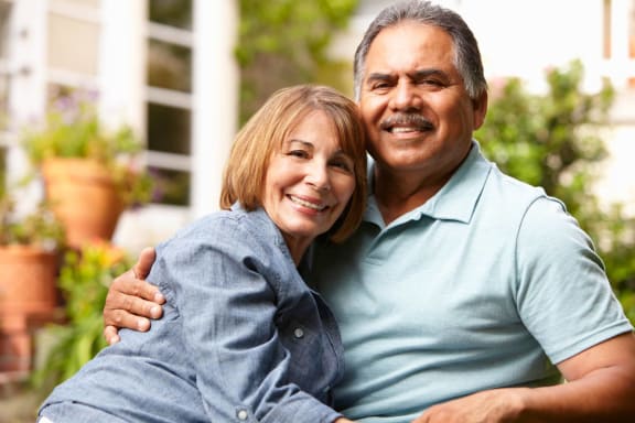 a man and a woman posing for a picture together at Mariposa at Clear Creek Webster 55+ Apartments, Webster, TX