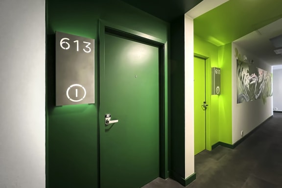 bright green residential doors at on 6th floor of Citizen Birmingham