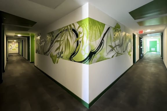 A mural of green leaves and flora on 6th floor of Citizen Birmingham