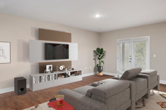 a living room with a couch and a tv on the wall